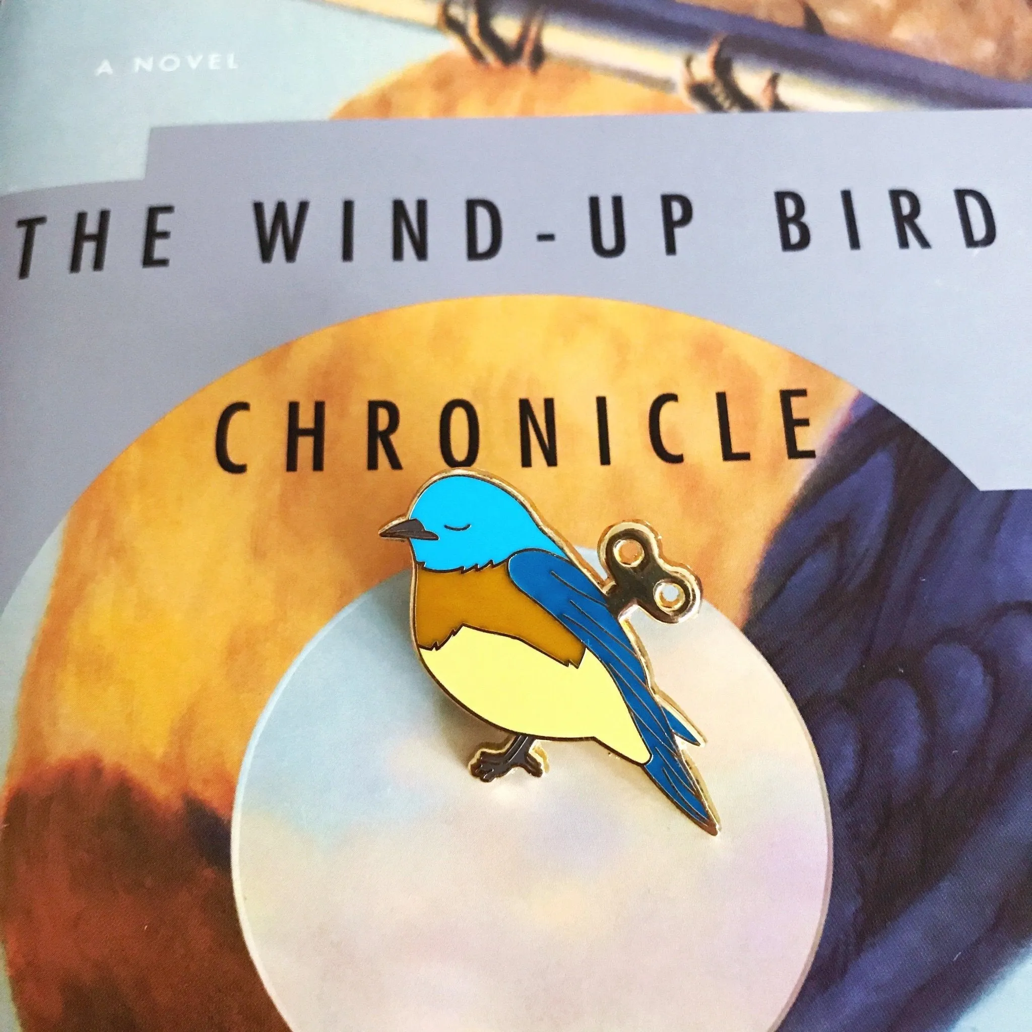 Wind-Up Bird Enamel Pin